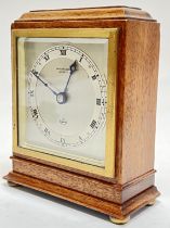 An Elliott mantle clock, retailed by Jamieson & Carry of Aberdeen, with roman numeral indices and