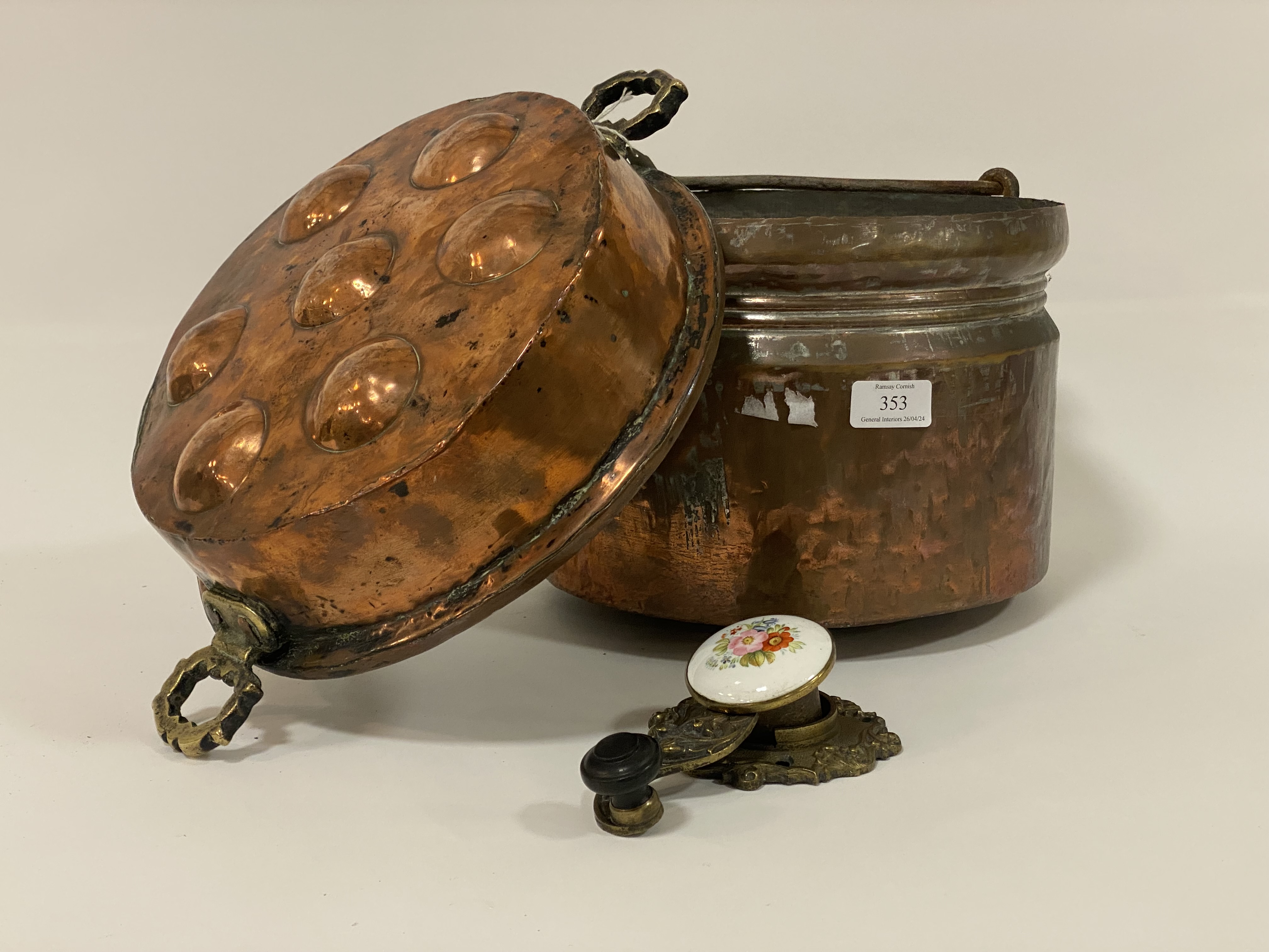 An eastern copper pot with steel swing handle (W30cm, H22cm), together with a copper fruit / egg