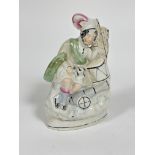 A Victorian Staffordshire china flatback figure the Scottish sleeping drummer decorated with