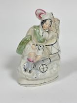 A Victorian Staffordshire china flatback figure the Scottish sleeping drummer decorated with
