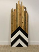 A polished pine wall hanging panel decorated with chevron design. L190cm.