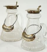 A pair of Birmingham hallmarked Hukin and Heath silver topped miniature jugs (largest h-11cm) with