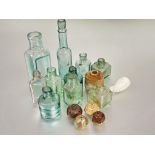 A collection of ten vintage green and clear glass bottles a/f tallest H x 16cm, clay pipe bowl