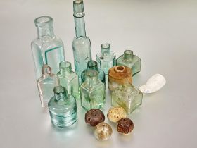 A collection of ten vintage green and clear glass bottles a/f tallest H x 16cm, clay pipe bowl