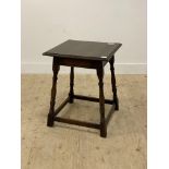 An 18th century style oak side table, the square moulded top above ring turned and block supports