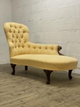 A Victorian mahogany framed spoon back chaise longue, well upholstered in deep buttoned pale