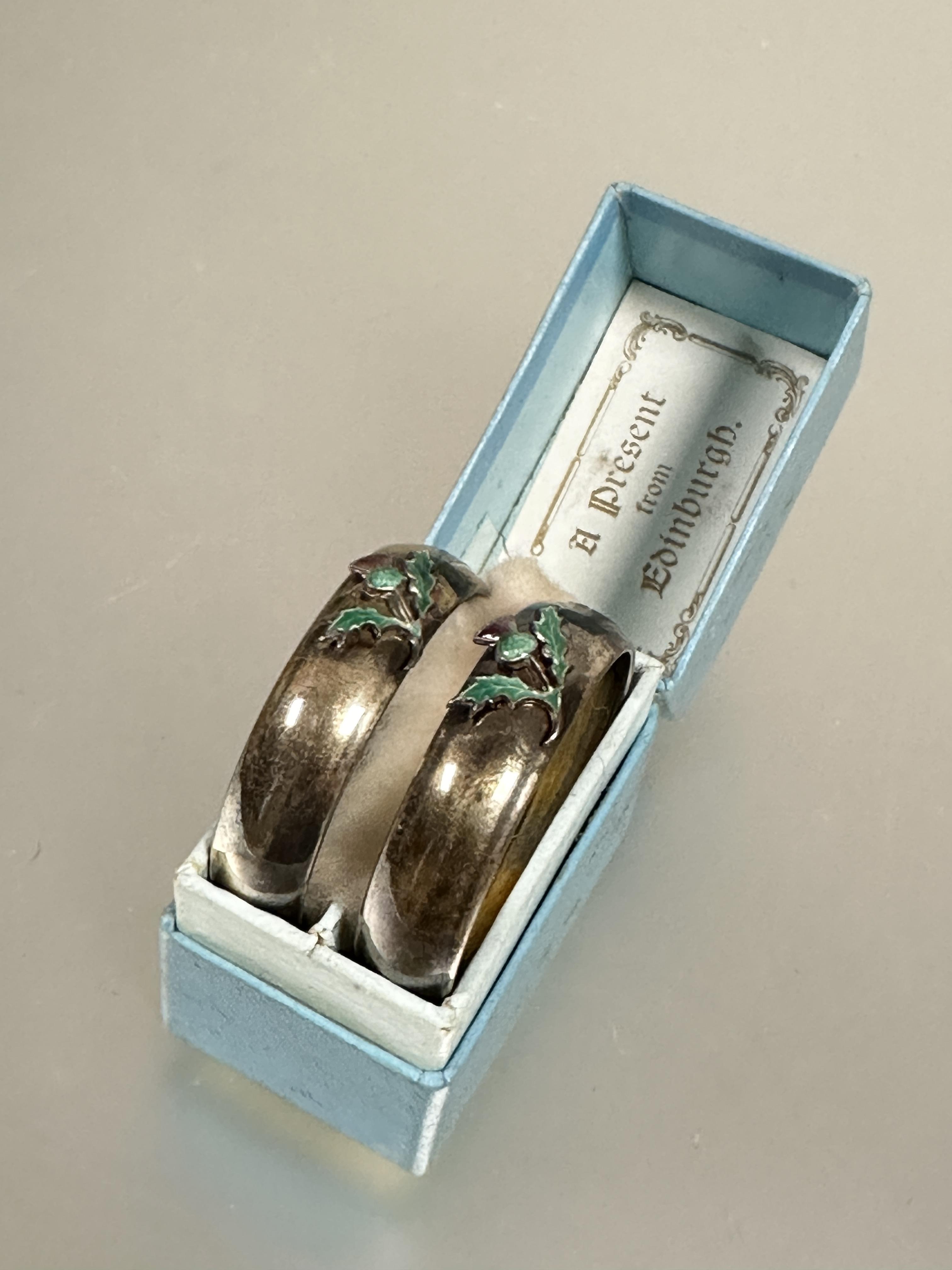 A pair of Edwardian Birmingham silver circular napkin rings mounted with enamel Scottish thistles no - Image 4 of 4