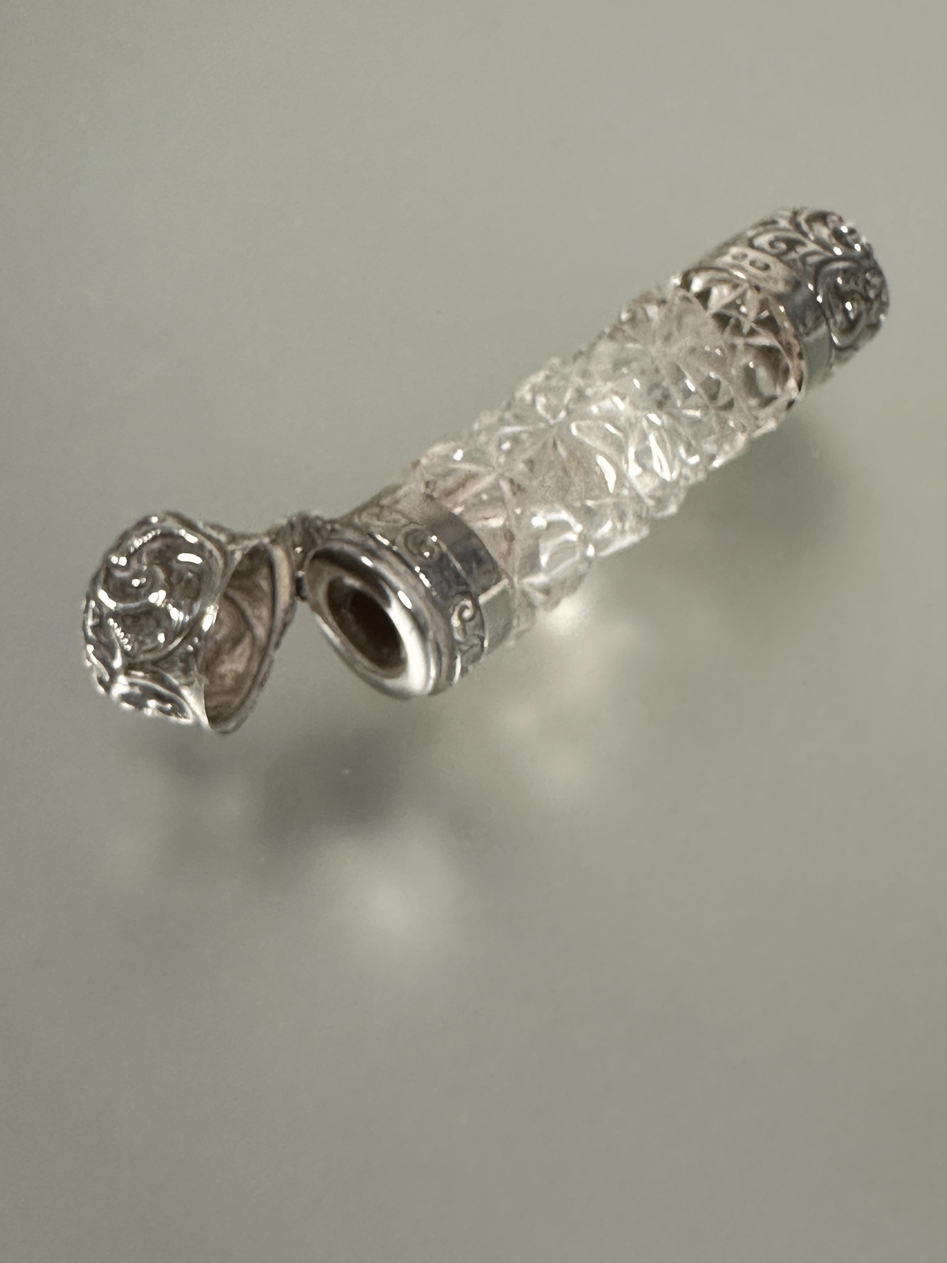 A Victorian silver mounted ended smelling salts bottle with hob nail cut design missing inner - Image 2 of 2