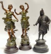 A group of three spelter figures comprising two baroque style female figures with patinated