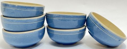 A set of six Buchan ware blue glazed pottery bowls with moulded/roulette decoration to exterior (