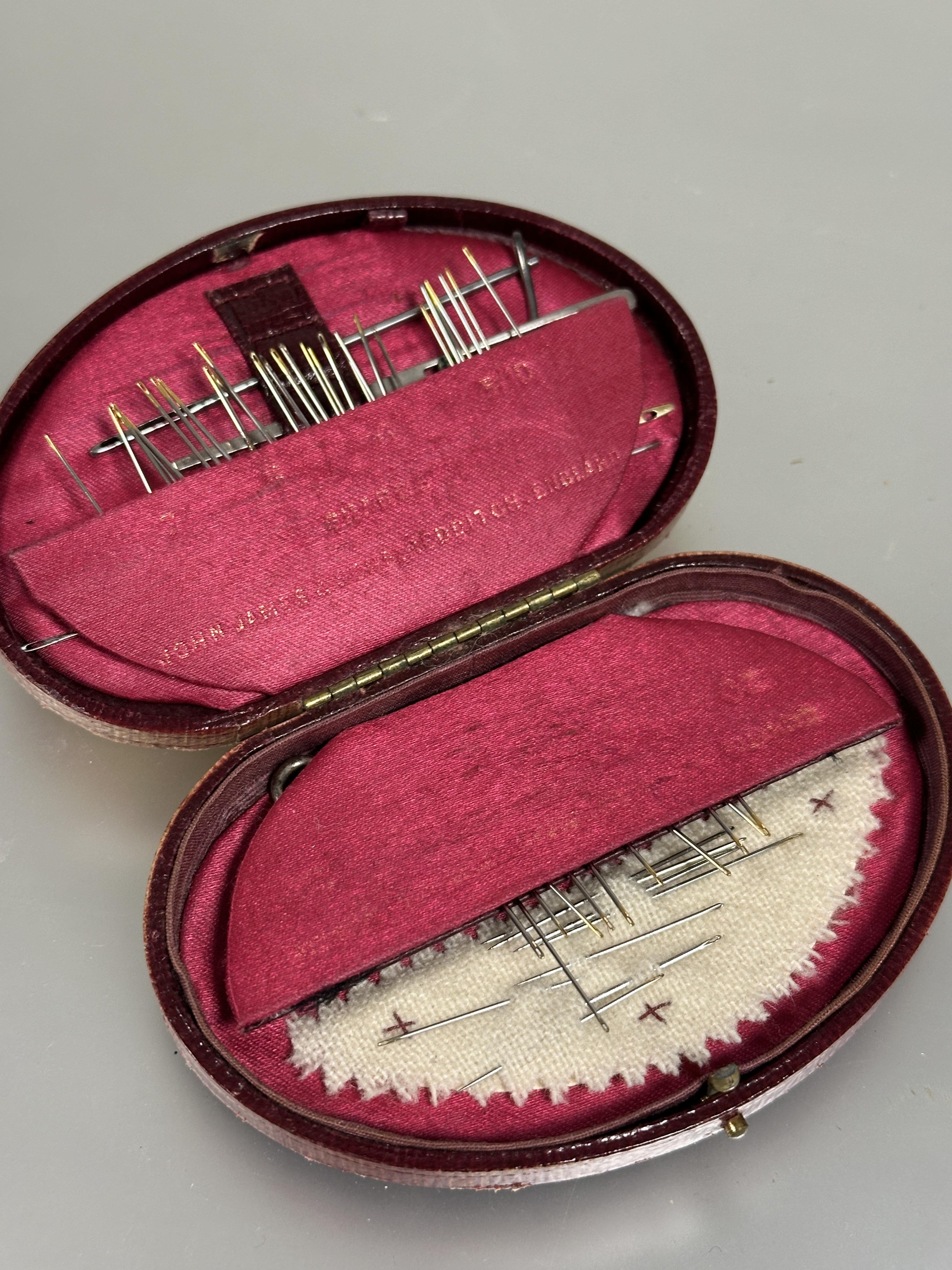 A Edwardian John James & Sons Reddich Moroccan faded red leather shaped sewing case fitted with - Image 2 of 5