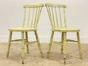 A pair of late 19th century Arts and Crafts green painted hardwood side chairs, with comb backs