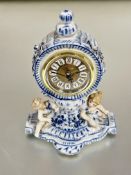 A 19thc continental drum head porcelain blue and white Meissen style mantle clock case with knop