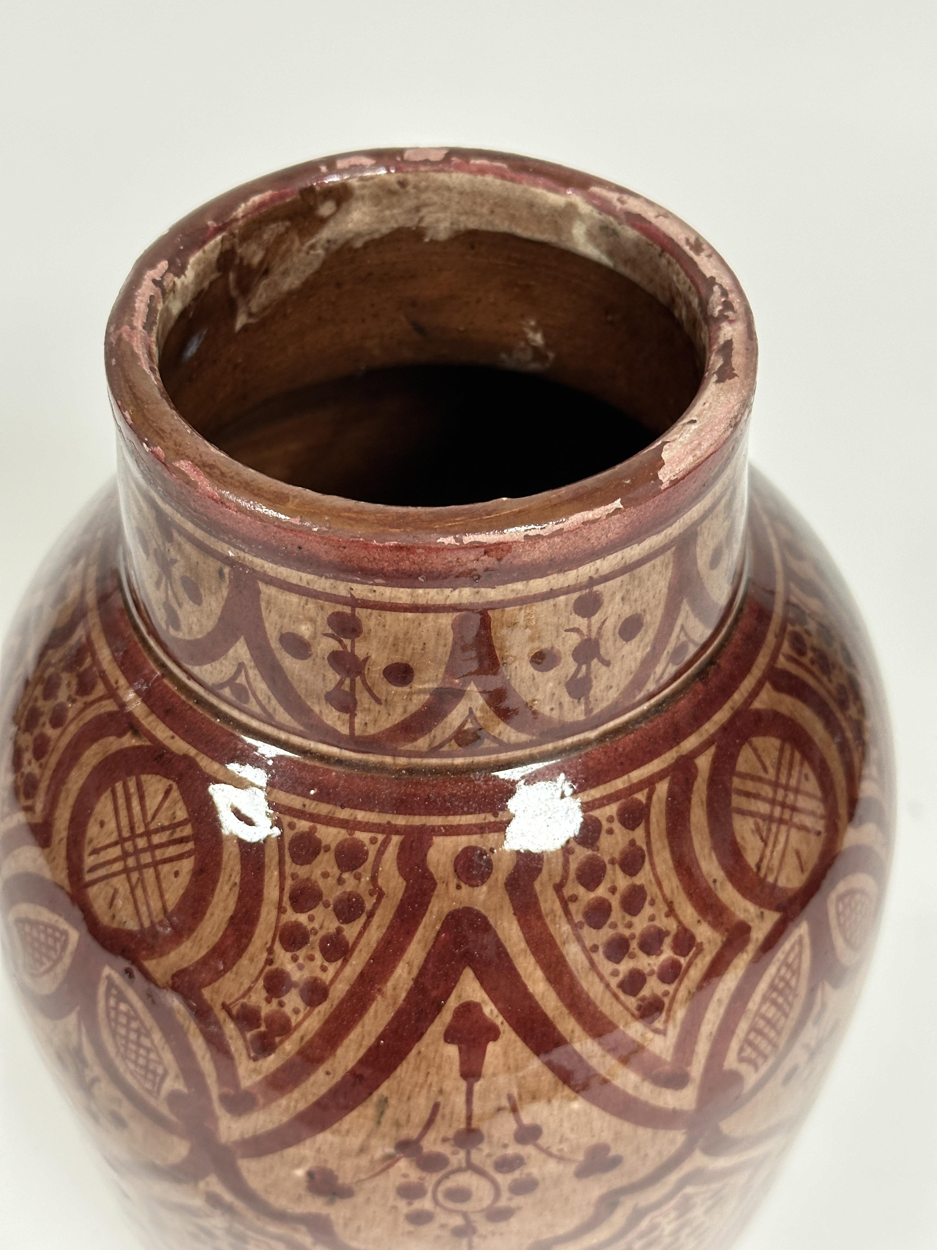 A Moroccan "Safi" red clay glazed tapered cylinder vase with stylized floral and lattice panel - Image 2 of 3
