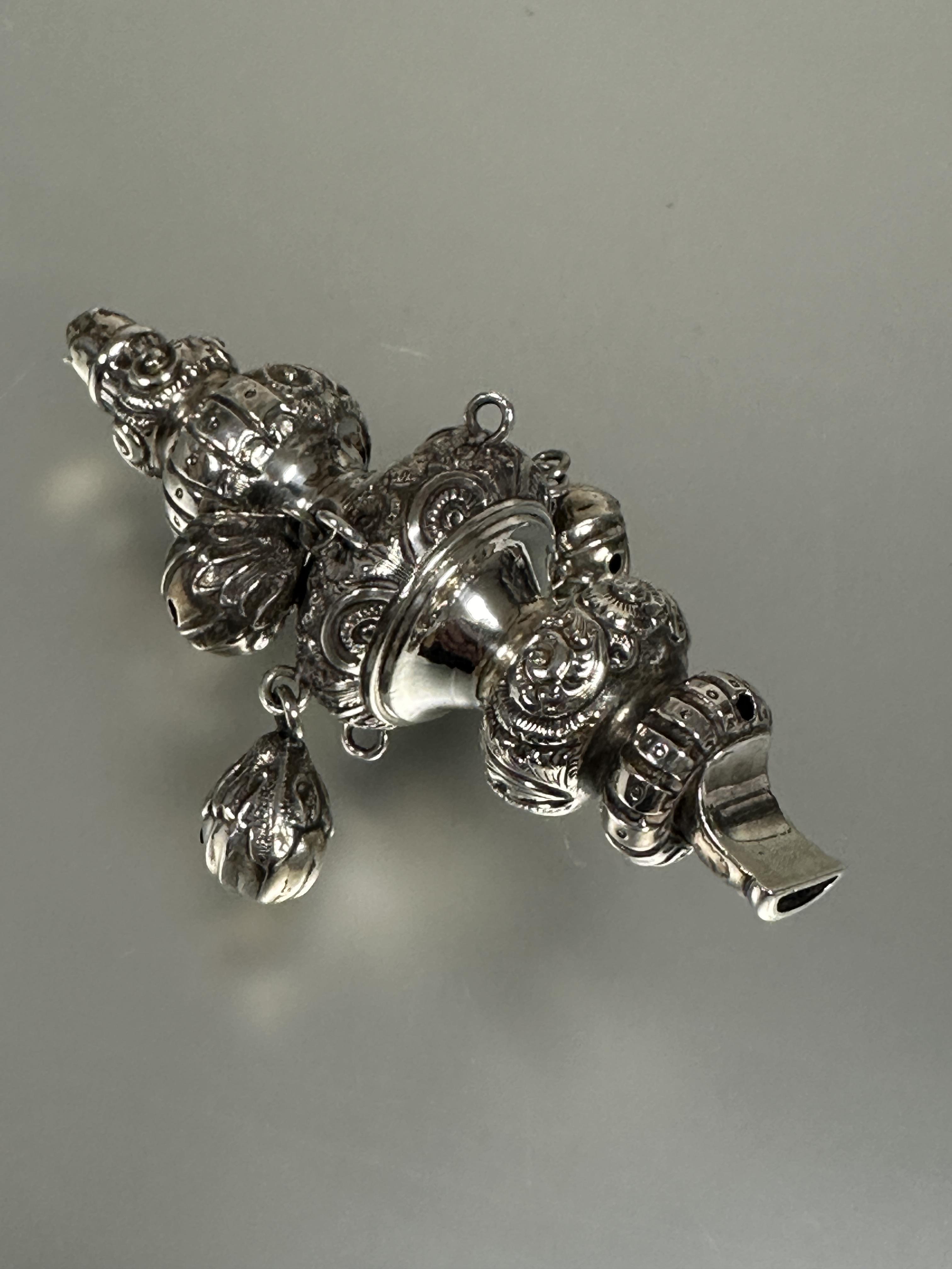 A 19thc white metal child's teething rattle/whistle of typical tiered form with cased scrolling - Image 2 of 3