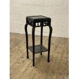 An early to mid 20th century Chinese style black painted jardiniere stand, raised on square