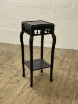 An early to mid 20th century Chinese style black painted jardiniere stand, raised on square