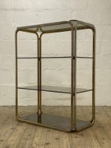 A Vintage 1980's four height gilt metal and smoked glass etagere. H108cm, W88cm, D43cm.