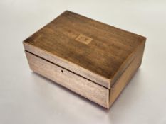 A early 19th mahogany box with box wood strung border and inlaid with initials L H enclosing a