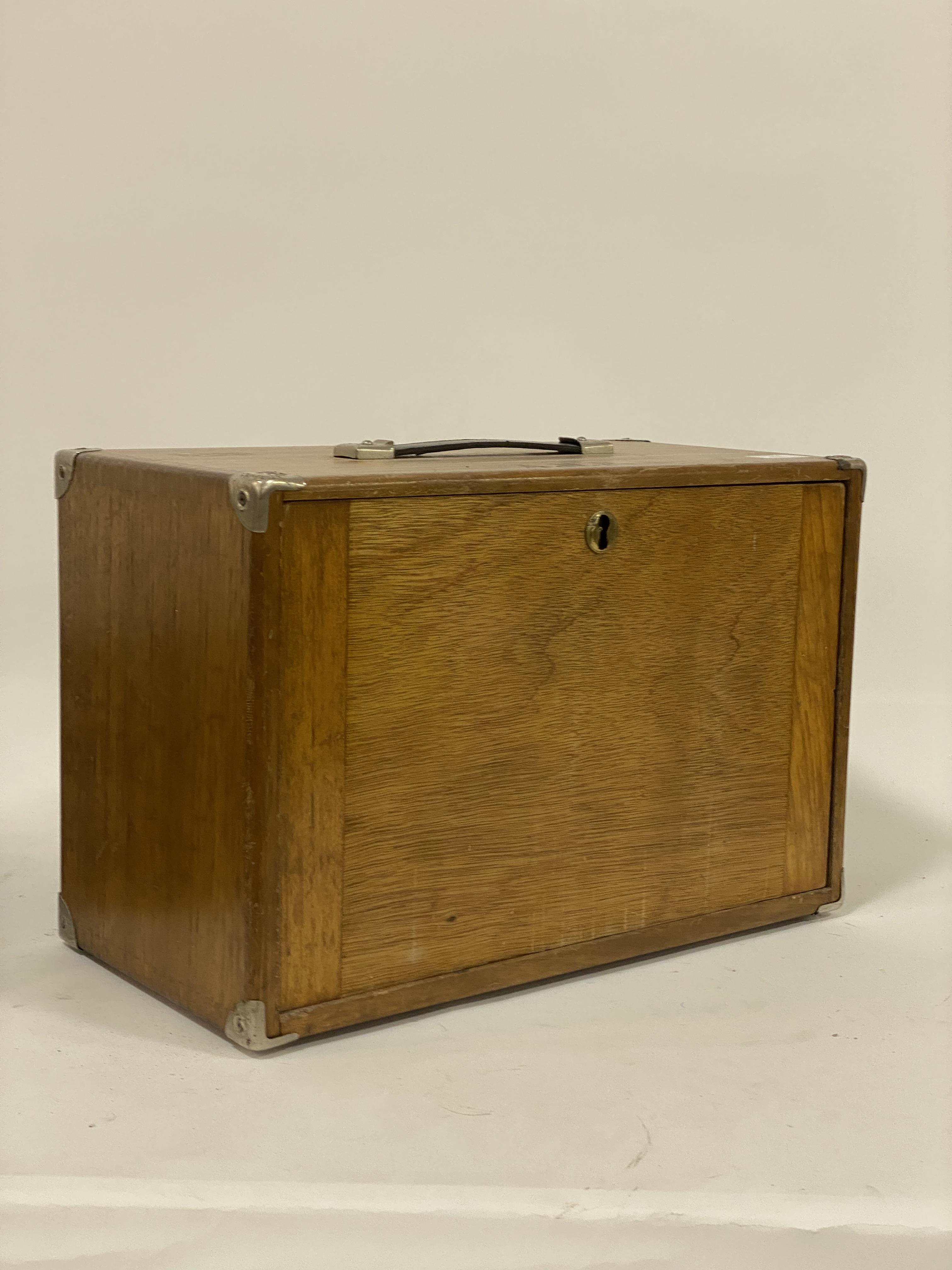 A vintage collectors cabinet, the hardwood case with metal bound corners and carry handle above a - Image 3 of 3