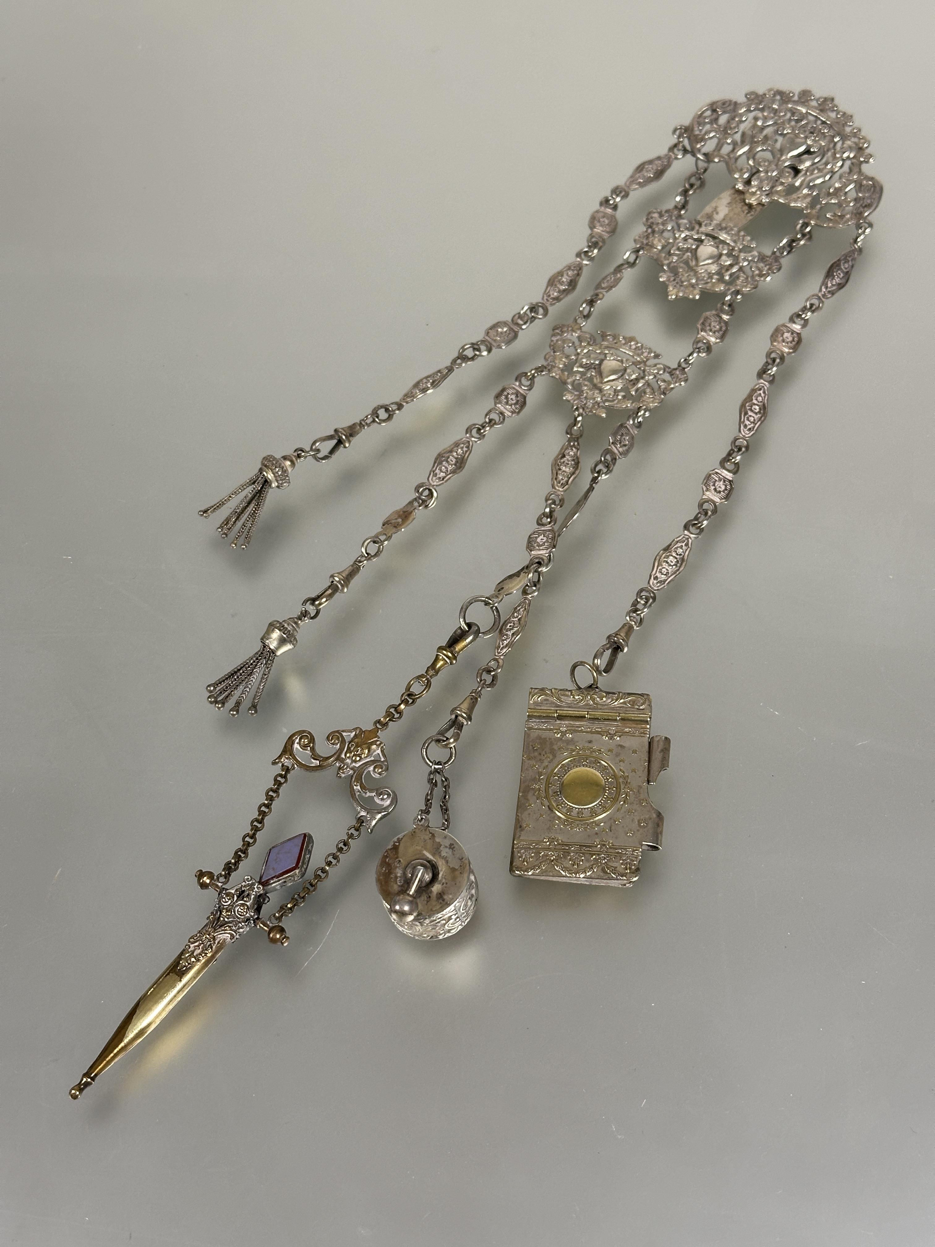 A Edwardian Birmingham silver Chatelaine the pierced top with cherubs above two panels with heart