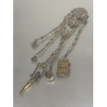 A Edwardian Birmingham silver Chatelaine the pierced top with cherubs above two panels with heart