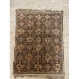 A hand knotted Turkish rug of repeating geometric design. 120cm x 88cm.