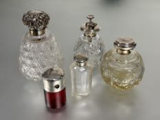 A large Victorian crystal slice cut flared perfume bottle with Birmingham silver hinged mounted