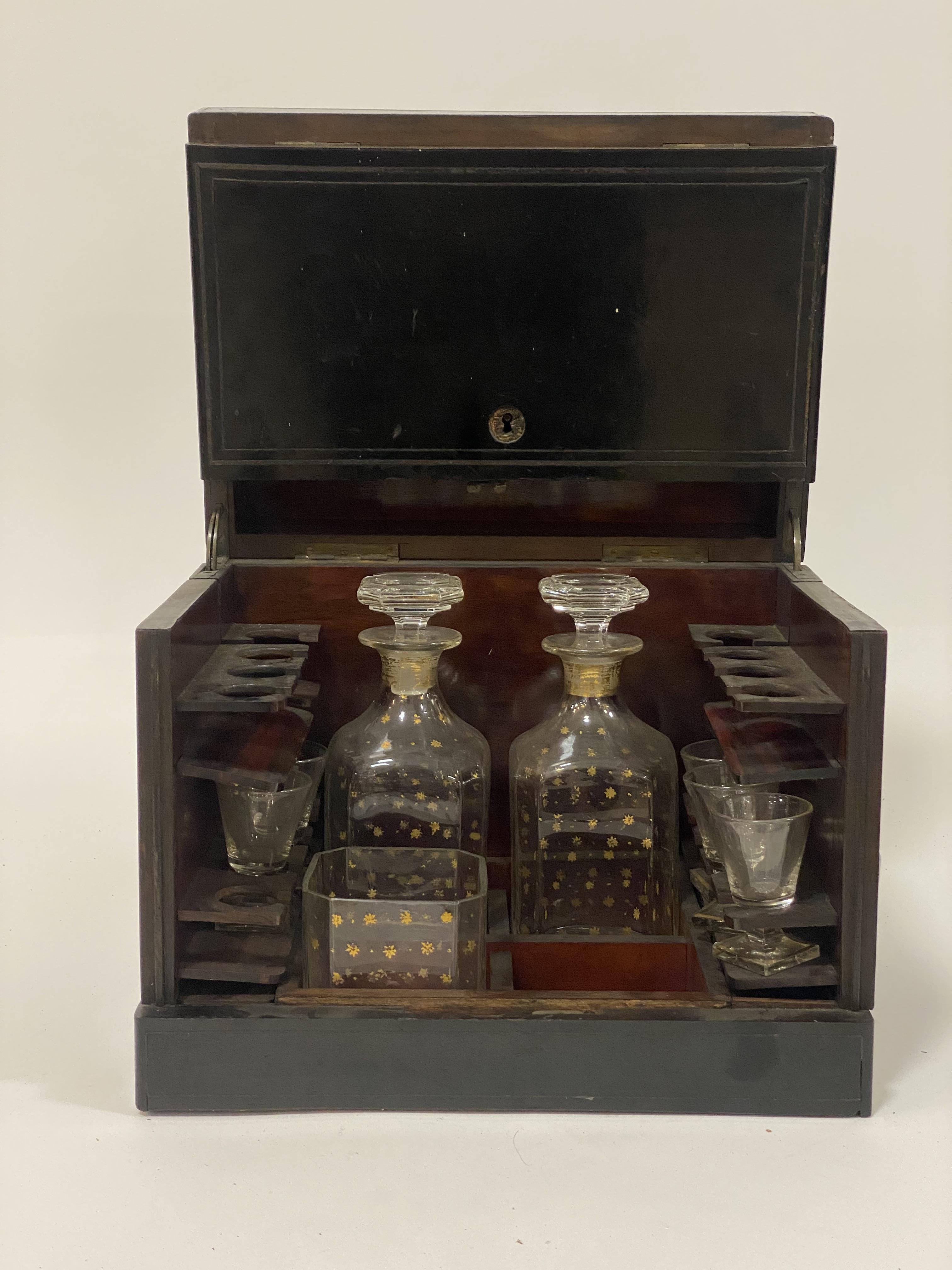A mid19th century ebonised tantalus or drinks casket, the hinged lid enclosing a simulated - Image 3 of 3