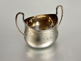 A Edwardain Birmingham silver oval two handled sugar bowl with reeded border to top engraved with