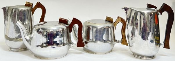 A group of mid-century sycamore handled aluminium Picquot Ware tea/coffee pots (two coffee pots, two