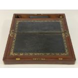 A 19th century mahogany brass bound writing slope, having a fitted interior and inset with gilt