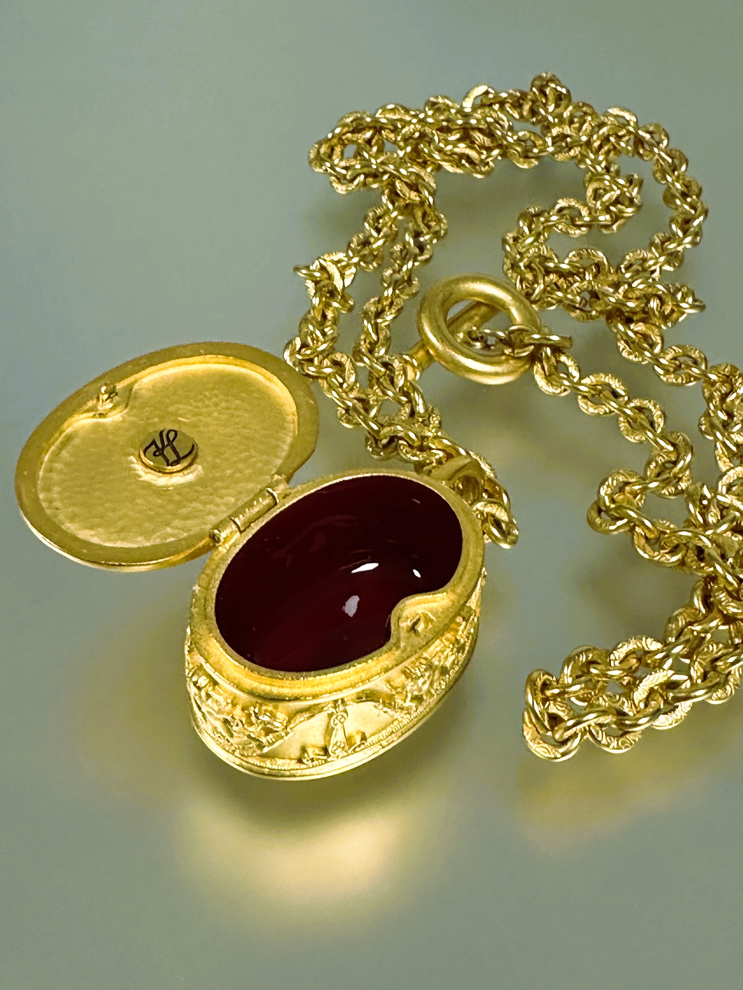 A vintage Karl Lagerfeld 1980s- 90s gilt oval pill box pendant on oval link chain, the hinge top - Image 2 of 3