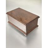A 1920s hand made walnut cigarette box, the hinged top enclosing a rise and fall dispenser for forty