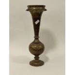 An early 20th century Indo-Persian brass and nielo ware vase of trumpet form. H66cm.