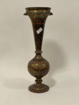 An early 20th century Indo-Persian brass and nielo ware vase of trumpet form. H66cm.