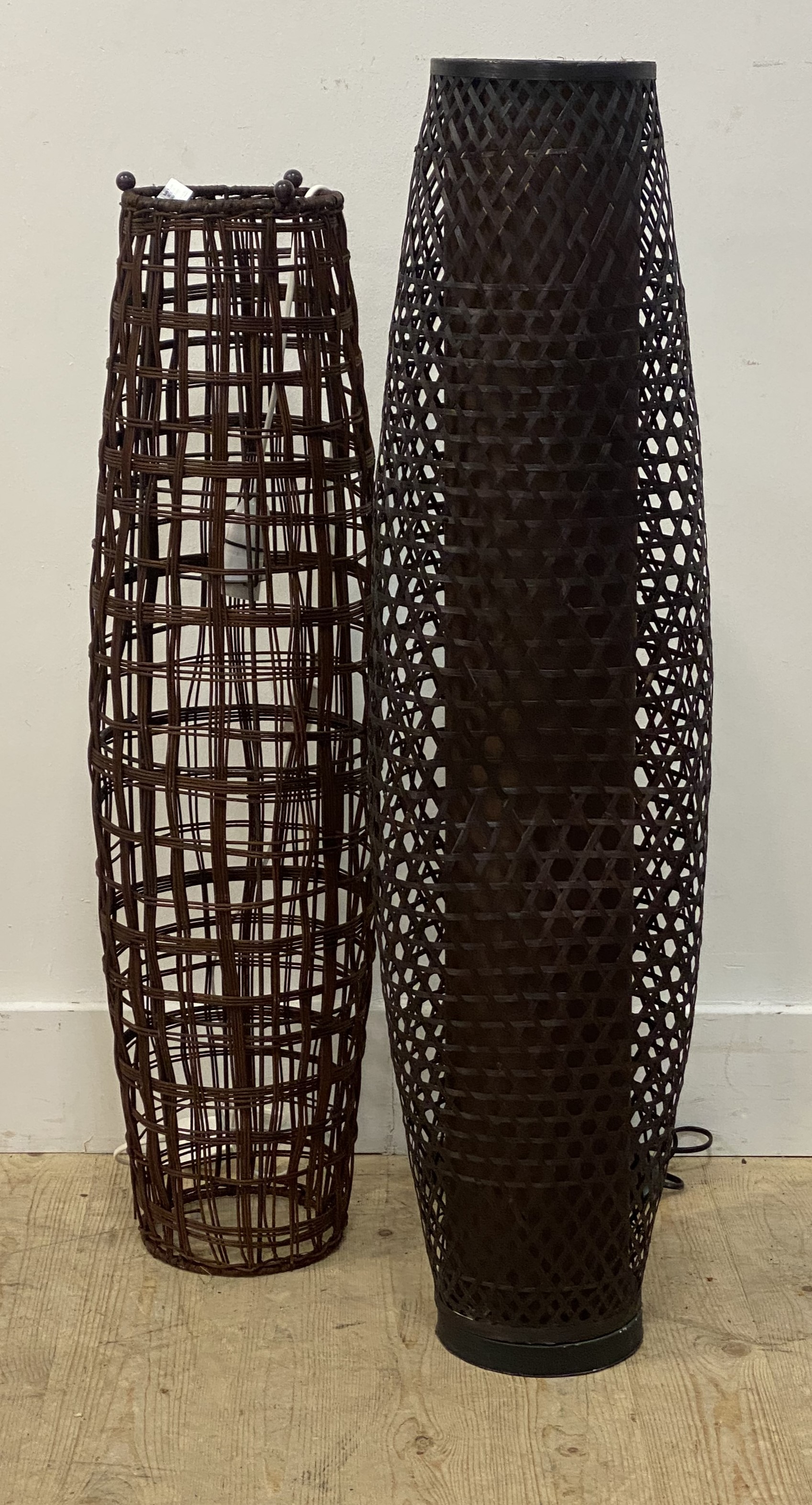 A matched pair of rattan floor lamps of compressed cylindrical form. larger H100cm.