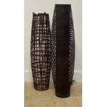 A matched pair of rattan floor lamps of compressed cylindrical form. larger H100cm.