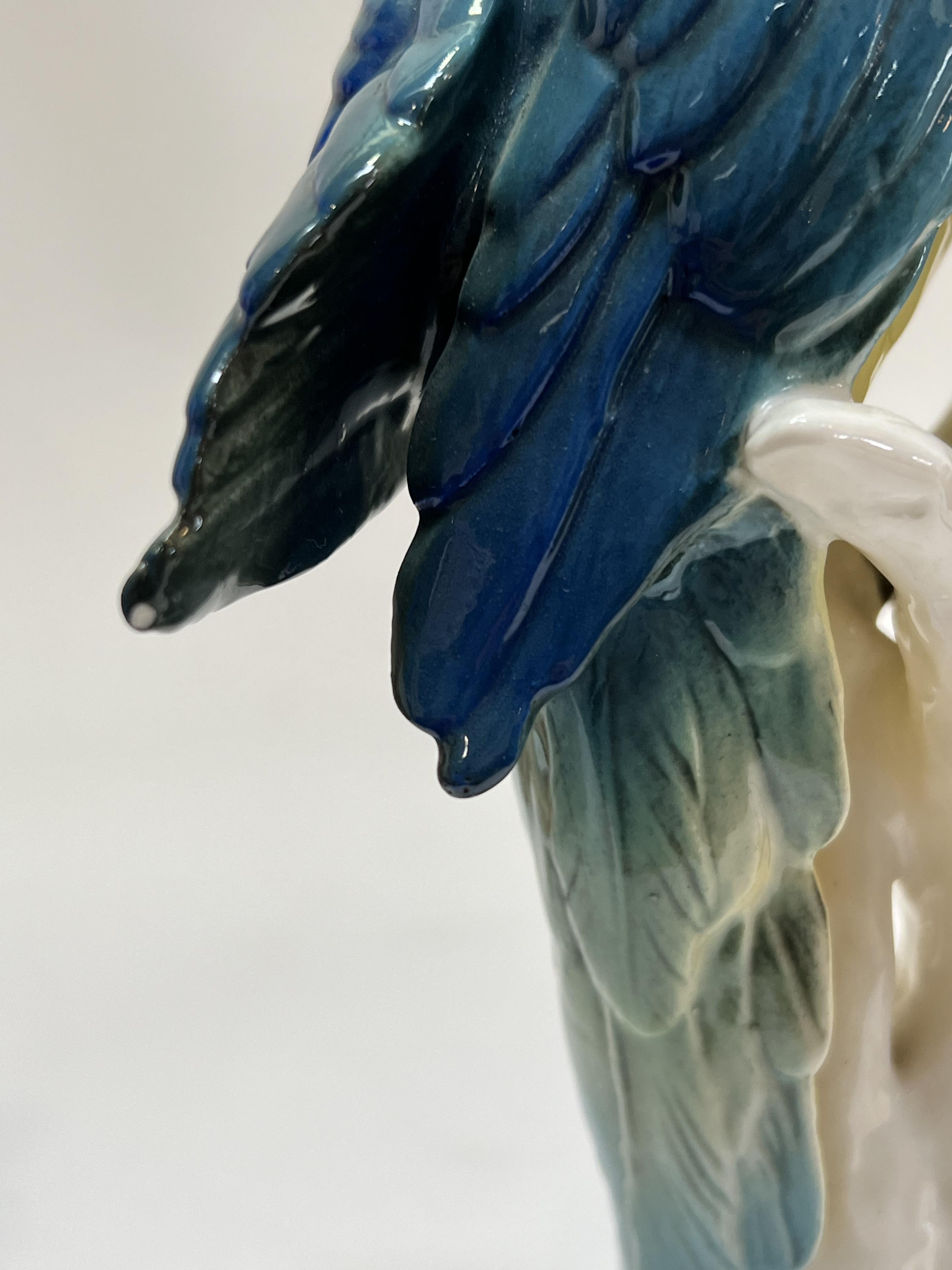 A large brightly glazed Karl Ens decorative parrot modelled perched on a fruiting branch (marked - Image 3 of 4