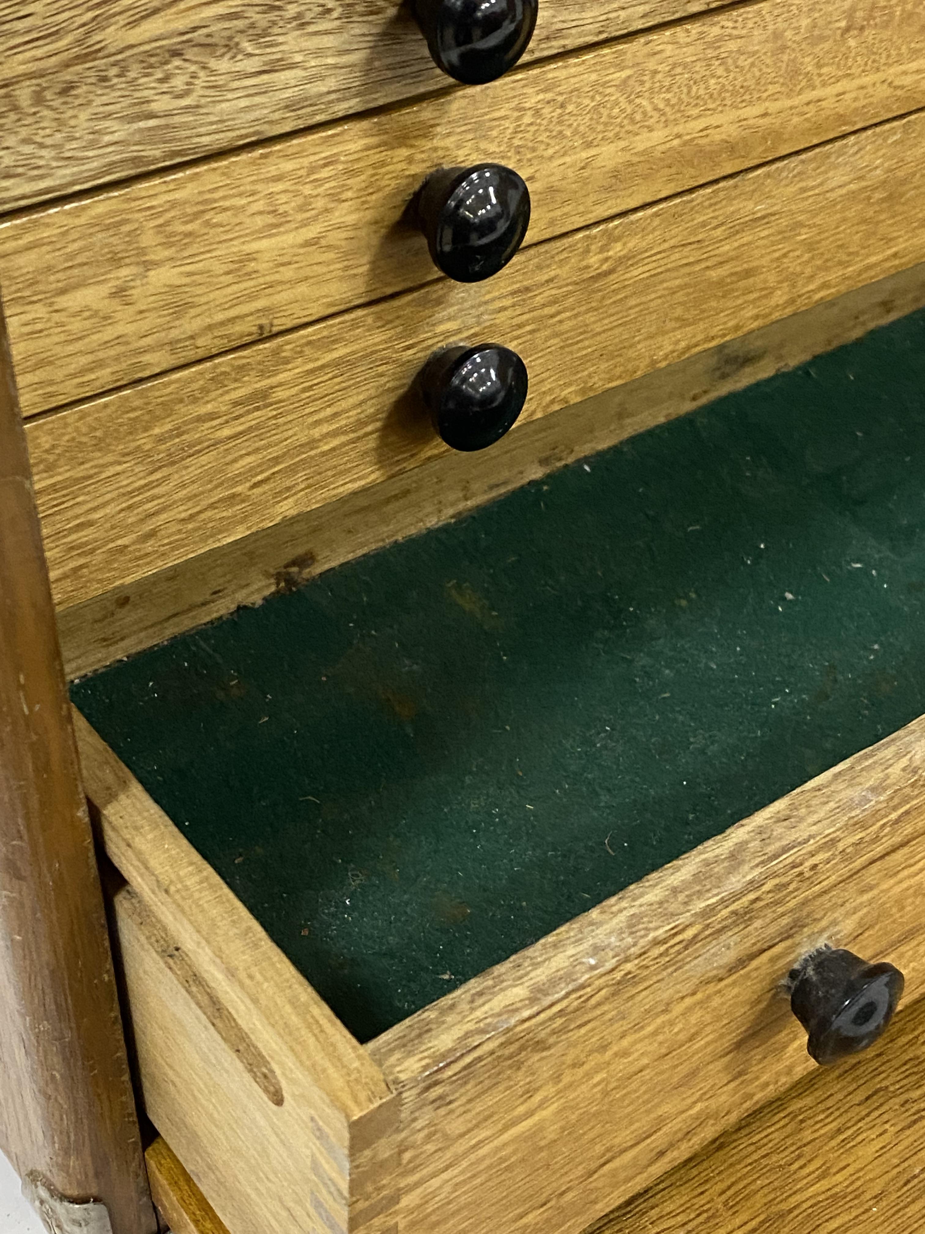 A vintage collectors cabinet, the hardwood case with metal bound corners and carry handle above a - Image 2 of 3