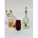 A pottery ginger toirtie point seated cat figure with inset green glass eyes  H x 26cm, a ruby glass