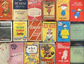 A group of seventeen vintage sets of novelty playing cards including Peanuts, Charlie Brown, Snoopy,