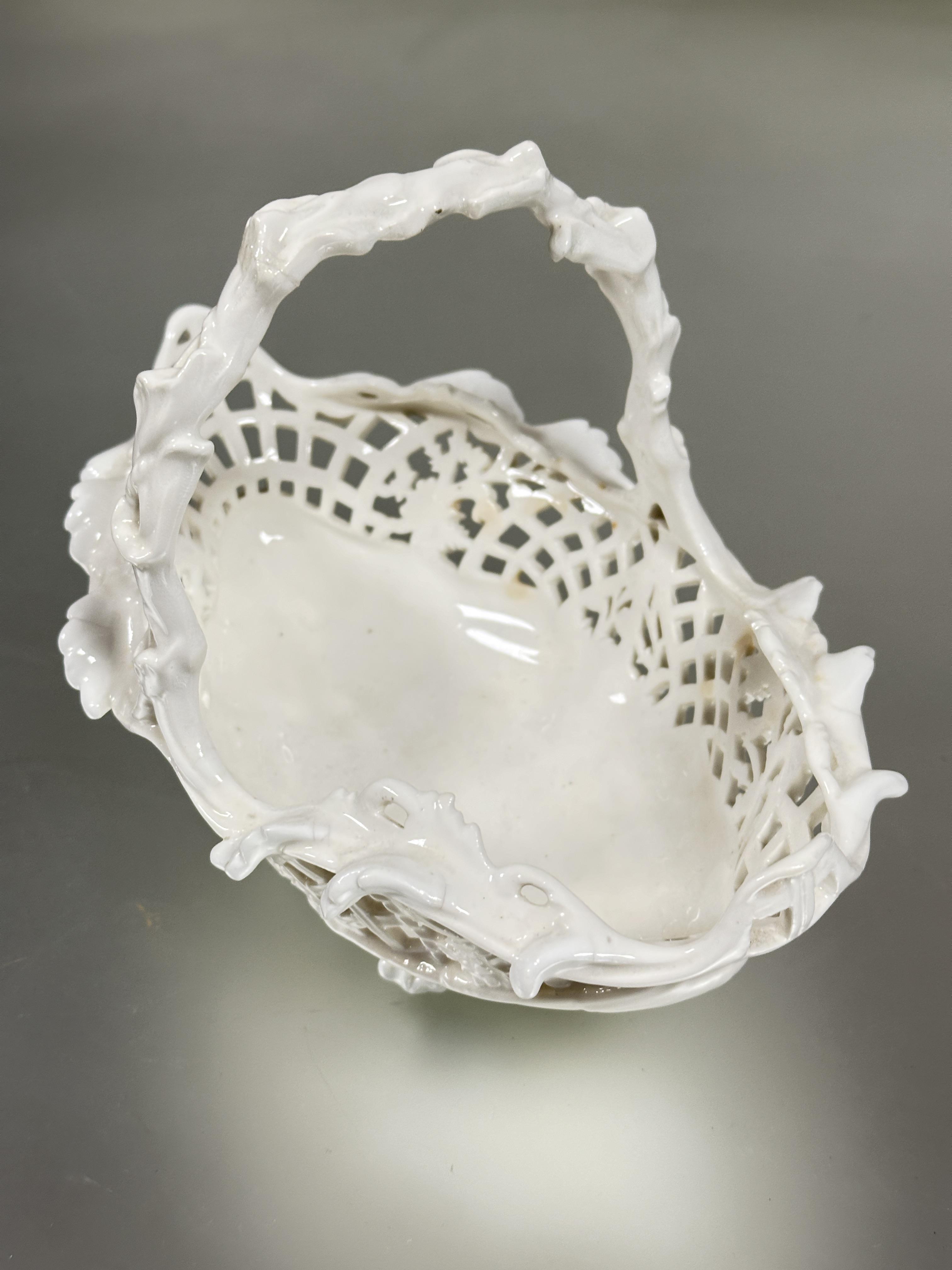 A Edwardian Coalport china blanc de chine oval pierced floral art basket with rustic handle raised - Image 2 of 8