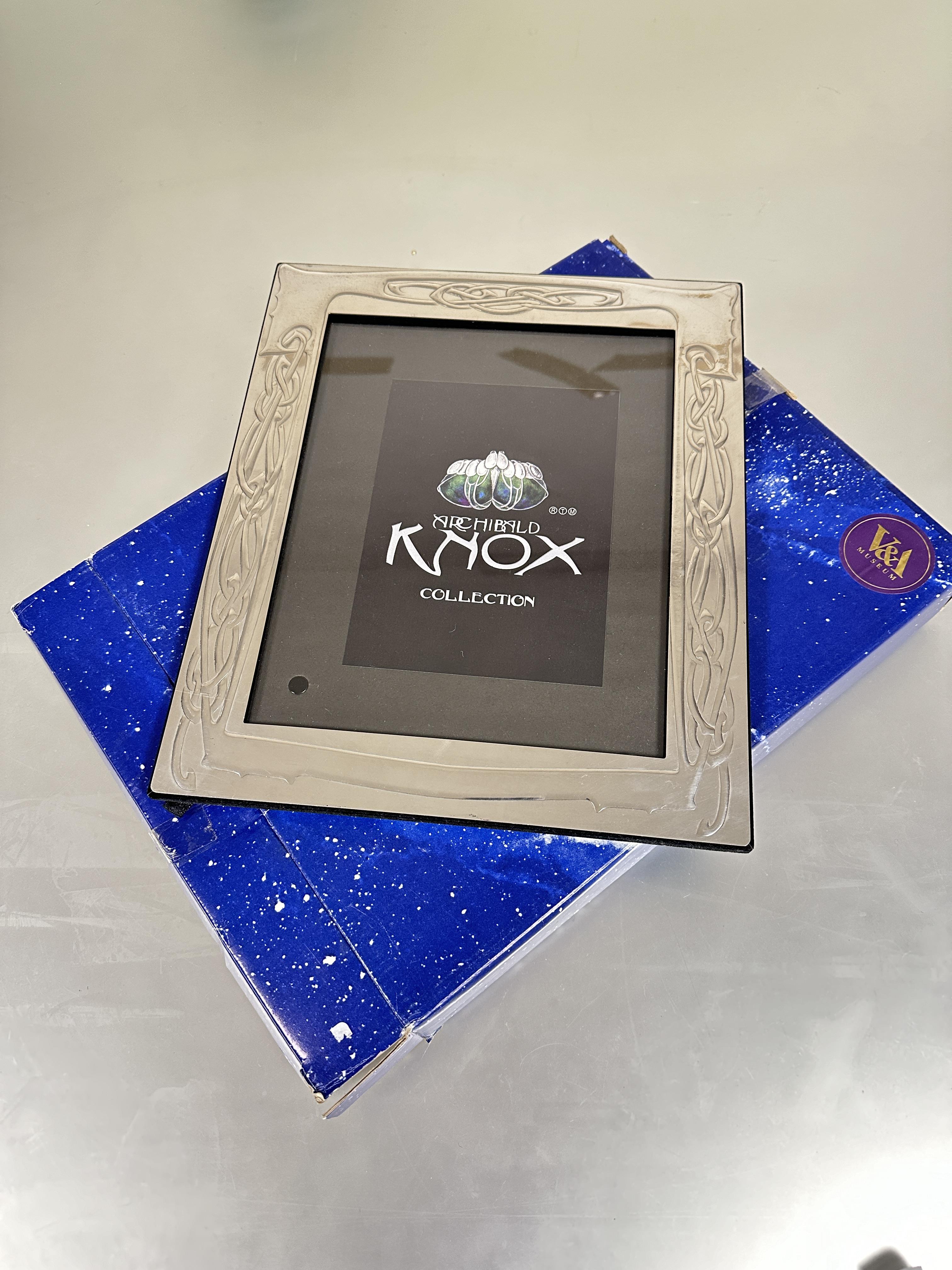 A Royal Selangor Archibald Knox collection pewter large photograph frame with stylized scrolling