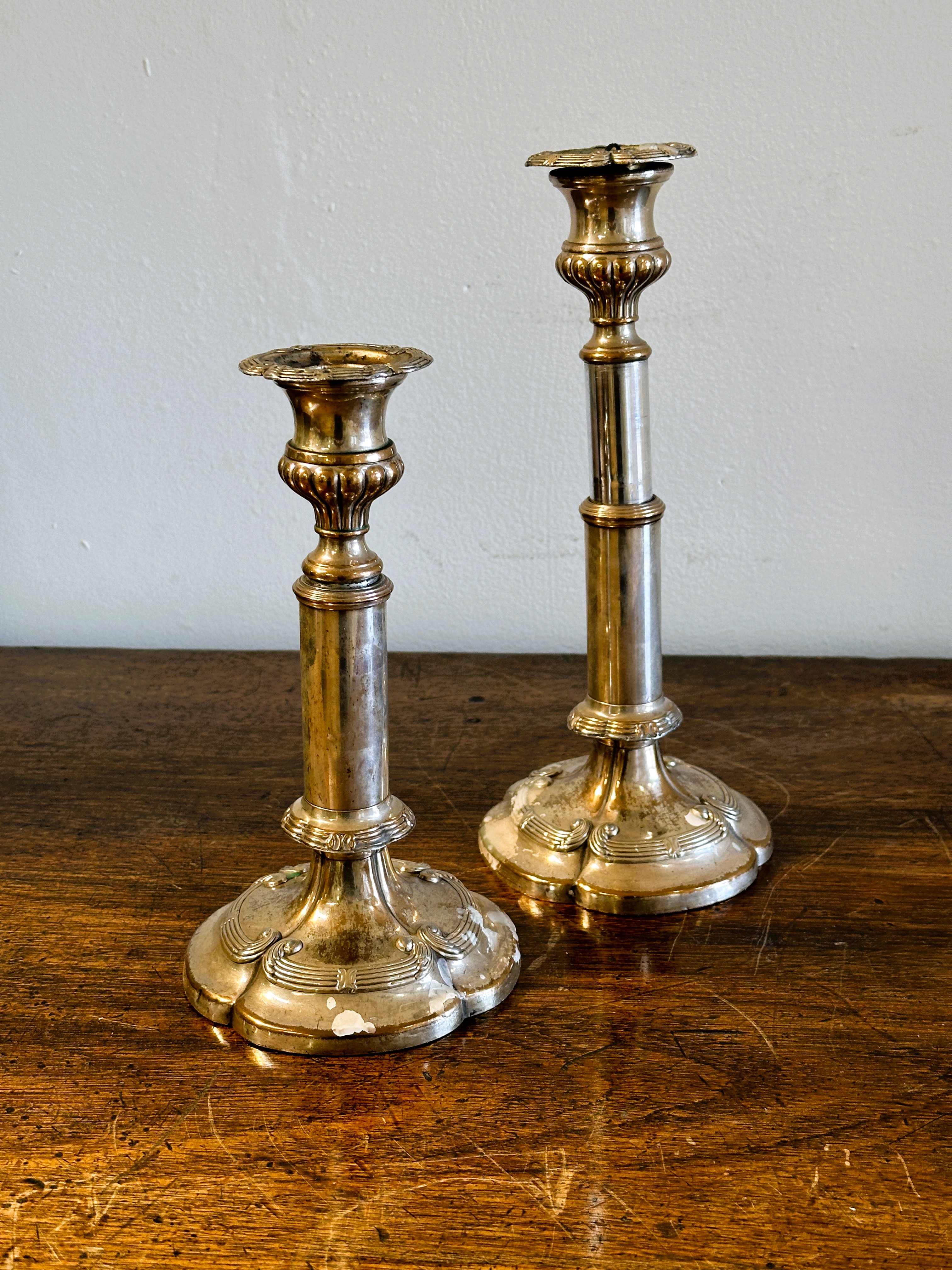 A Victorian pair of Sheffield plated telescopic candle sticks on tapered columns and scalloped - Image 2 of 3