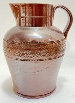 A large antique salt glazed stoneware jug with roulette decoration to exterior (h- 28cm, w- 24cm)