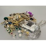 A large collection of costume jewellery to include sleeve links, clip on pairs of earrings, gilt