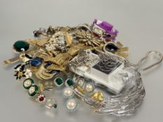 A large collection of costume jewellery to include sleeve links, clip on pairs of earrings, gilt