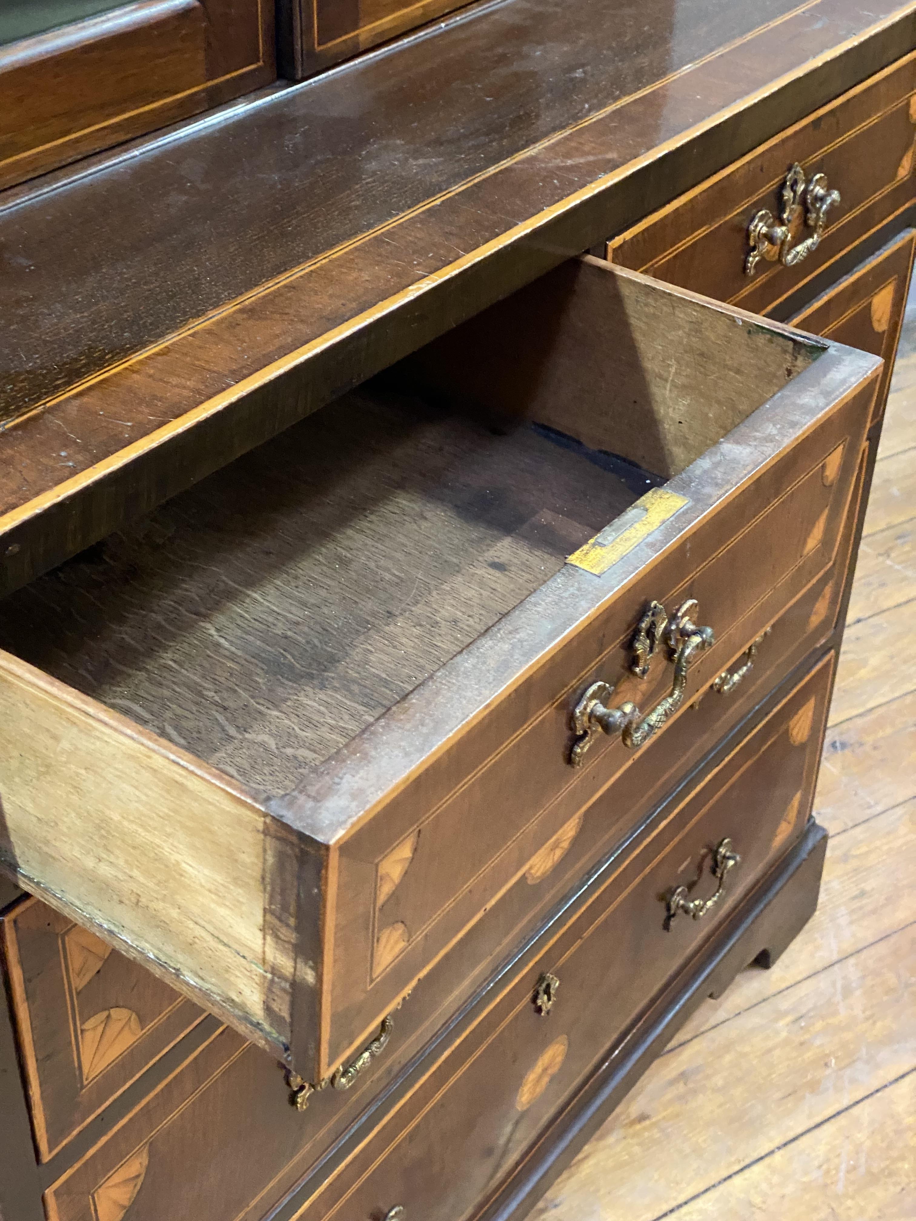 A George III mahogany bookcase on chest, the swan neck pediment with boxwood paterae, above two - Image 2 of 3