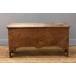 An English oak six plank coffer, late 18th century, the hinged lid opening on strap hinges to an